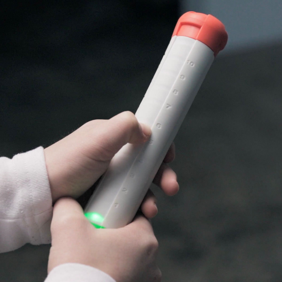 Stickflip electronic flip game held in hand